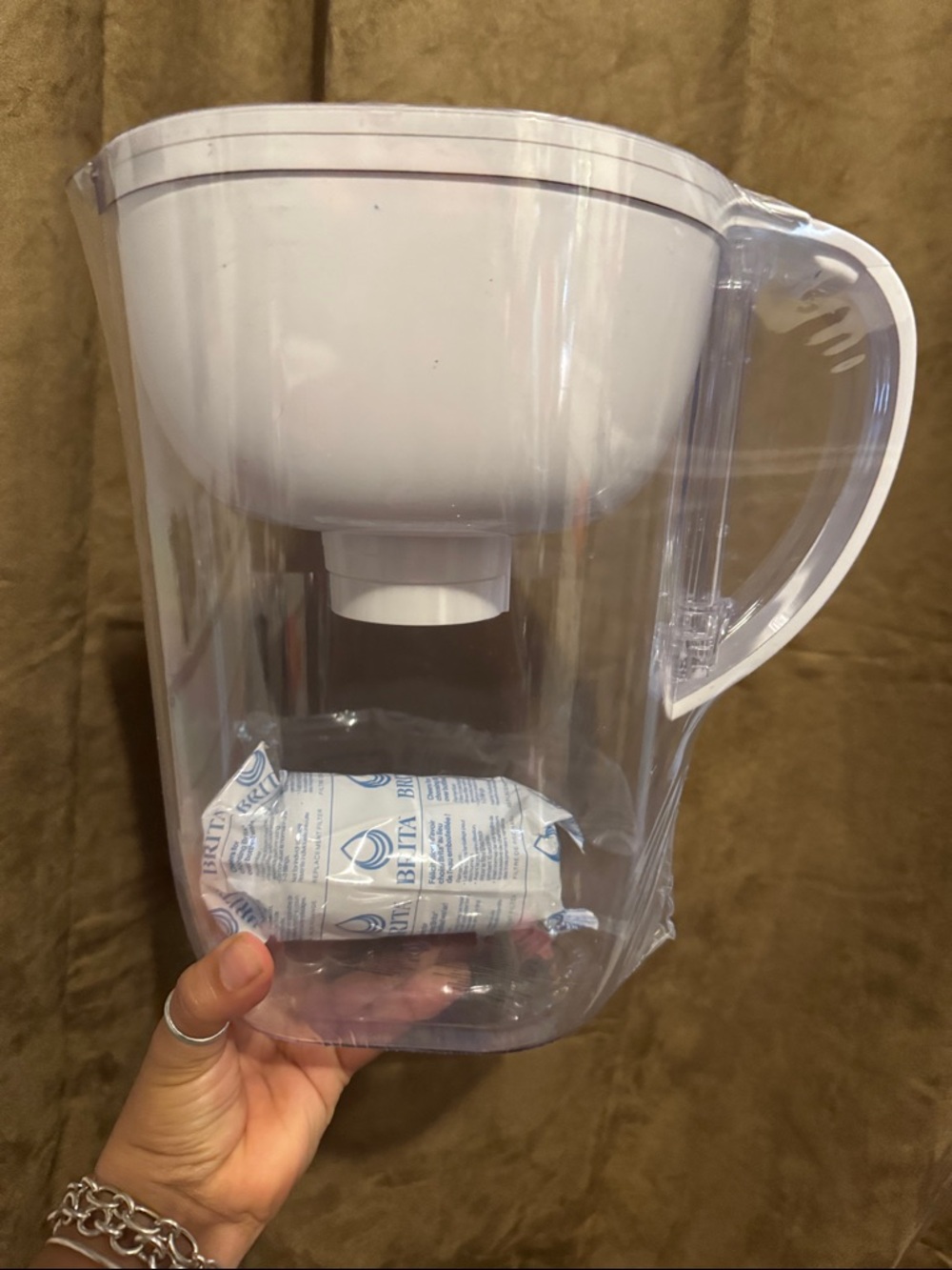Brita. Clear pitcher with white lid.